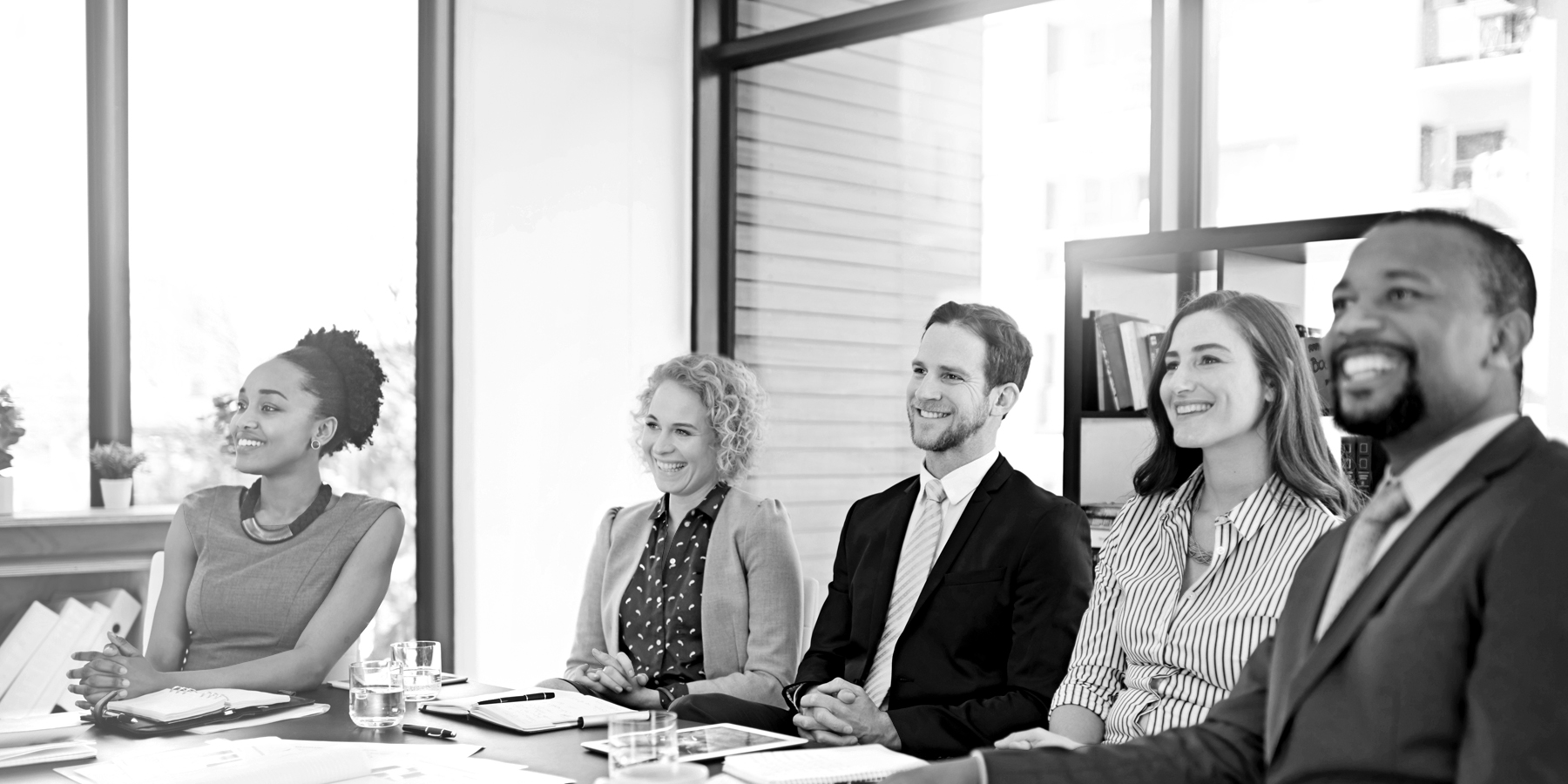 People smiling in a meeting